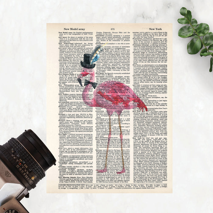watercolor flamingo wearing a top hat with feathers and a bow tie printed on salvaged dictionary paper