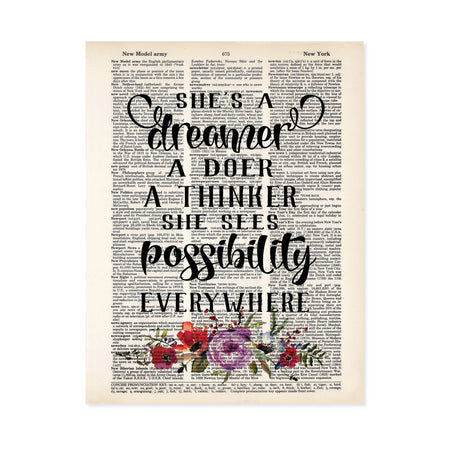 She's a dreamer a doer a thinker she sees possibility everywhere with lavender, pink, blue, and coral flowers and greenery in watercolor at the bottom printed on a dictionary page