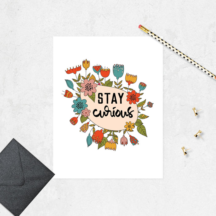 illustrated flowers in teal blue, peach, orange, and golden tones around a tear droped shape on angle with the words stay curious printed in black ink printed on matte white paper