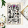 a friend is someone who knows the song in your heart and can sing it back to you when you have forgotten the words, this quote is printed on a salvaged dictionary page and has watercolor flowers in purples and blues