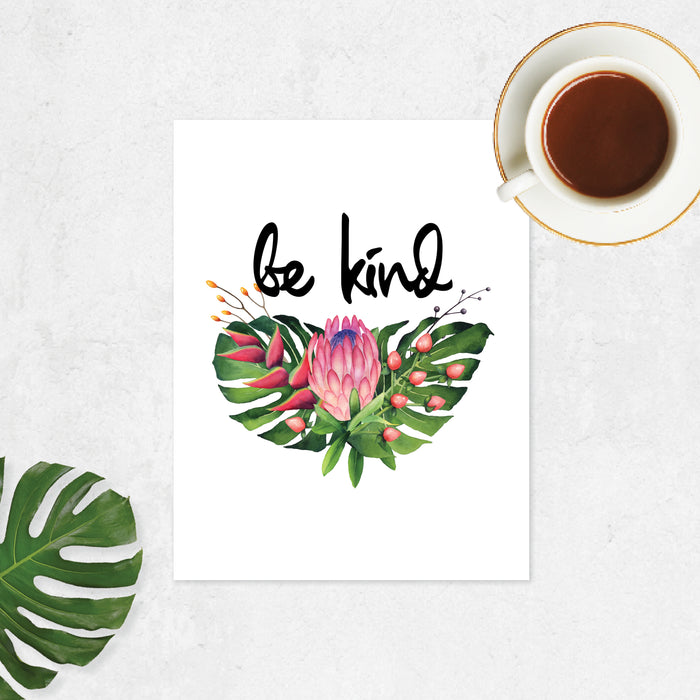 tropical leaves and flowers with the words be kind on matte white paper