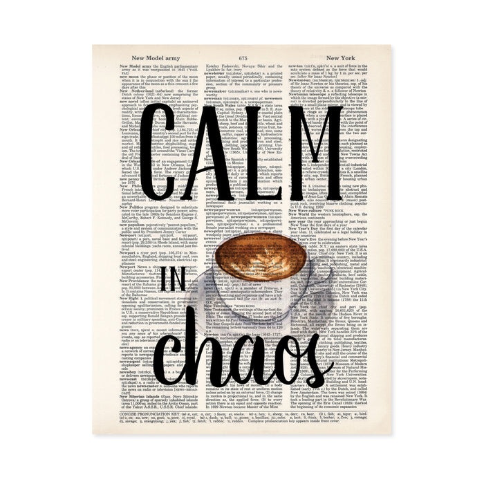 calm in chaos with a water color coffee cup with cream design on a saucer printed on a salvaged dictionary page