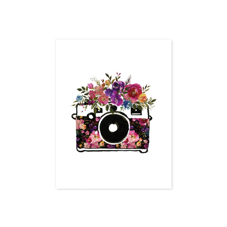 watercolor slr camera with flowers on the body of the camera and on top in deep shades of purple, pinks, blues, and greenery on matte watercolor paper