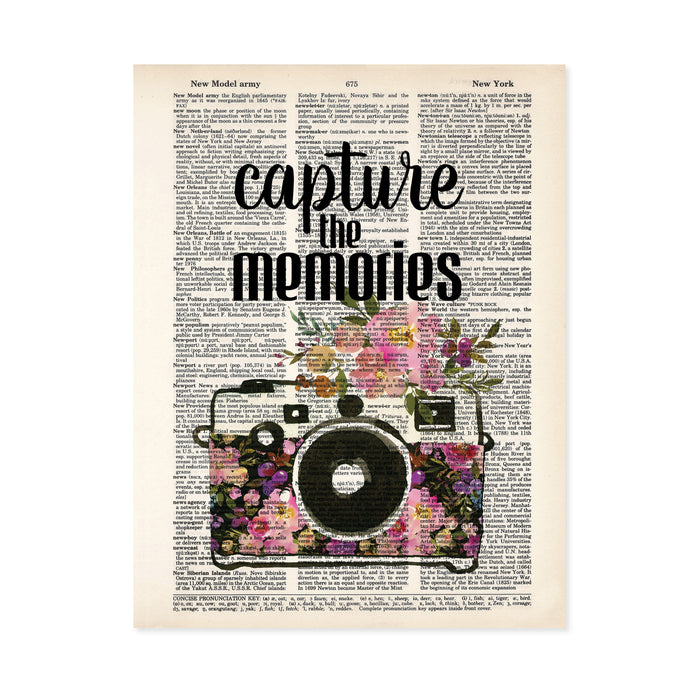 capture the memories quote and a watercolor camera decorated with watercolor flowers in pinks and purple tones on salvaged dictionary page