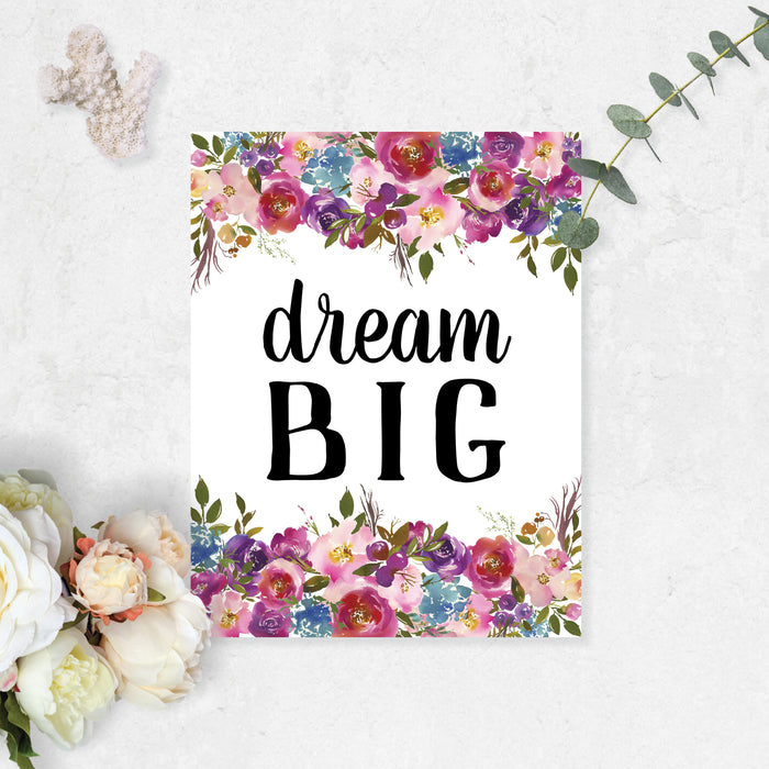 dream big on matte white paper with watercolor flowers top and bottom in shades of pinks, purple, greens, and blue