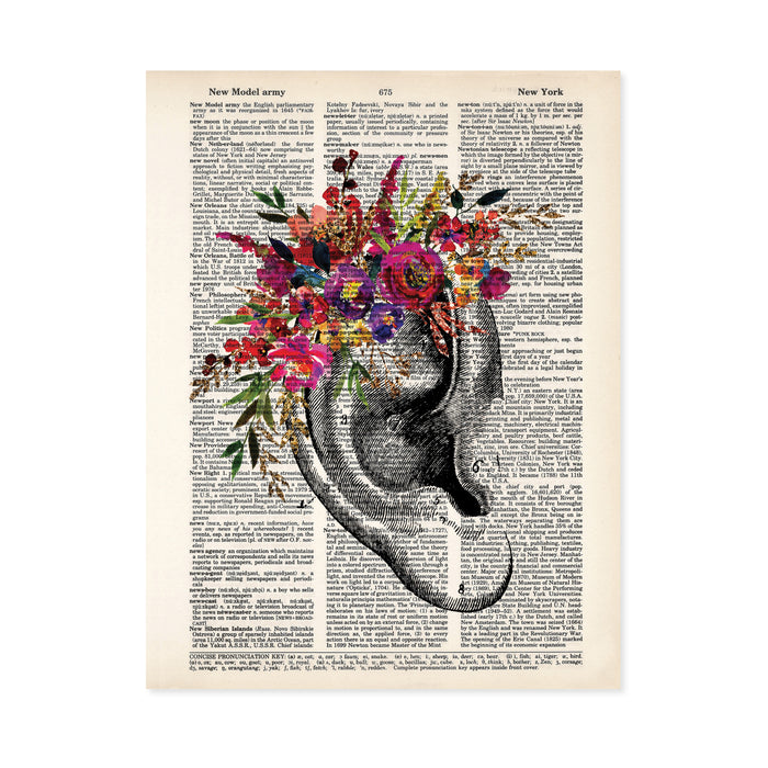 vintage ear etching topped with watercolor flowers in pinks, purples, yellows, and golden tones on salvaged dictionary paper