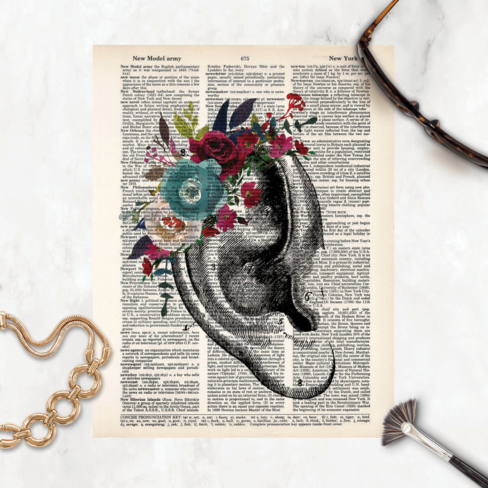 vintage ear etching with watercolor flowers in blues and reds on dictionary paper