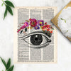 vintage eye etching with flowers for the eyebrow in pinks, purples, and red watercolors printed on a dictionary page