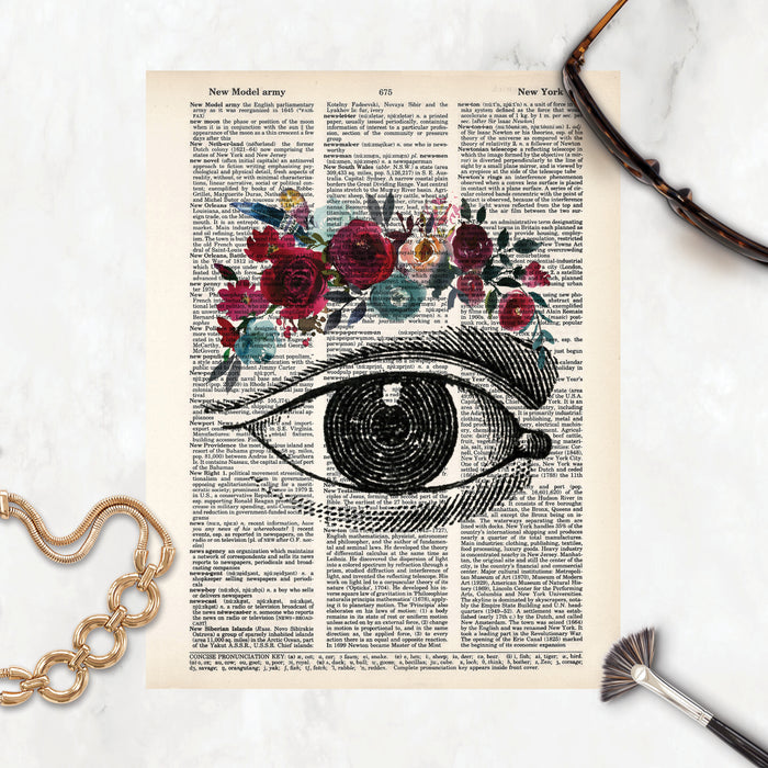 vintage eye etching with watercolor flowers as eyebrow in red and blues shades and feathers on salvaged dictionary paper