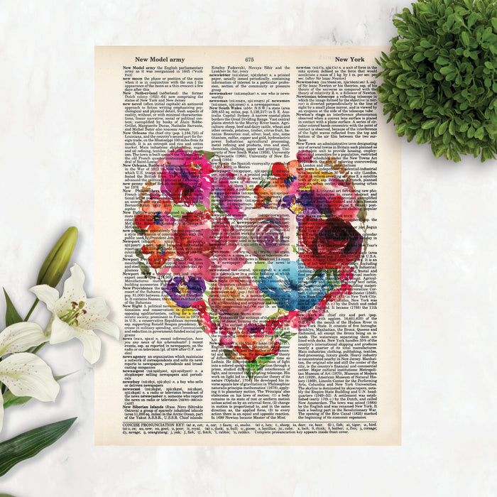 heart shape with watercolor flowers in pinks, reds, purples, yellows, and blue tones printed on a salvaged dictionary page