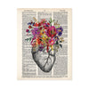 vintage etching of an anatomical heart topped with watercolor flowers in shades of pink, purple, yellow, and golden tones printed on a salvaged dictionary page