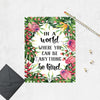 Tropical watercolor greenery and flowers surround the words In a world where you can be anything be kind on matte white paper
