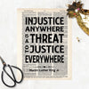 Martin Luther King Jr Quote Injustice anywhere is a threat to justice everywhere in black ink printed on salvaged dictionary paper