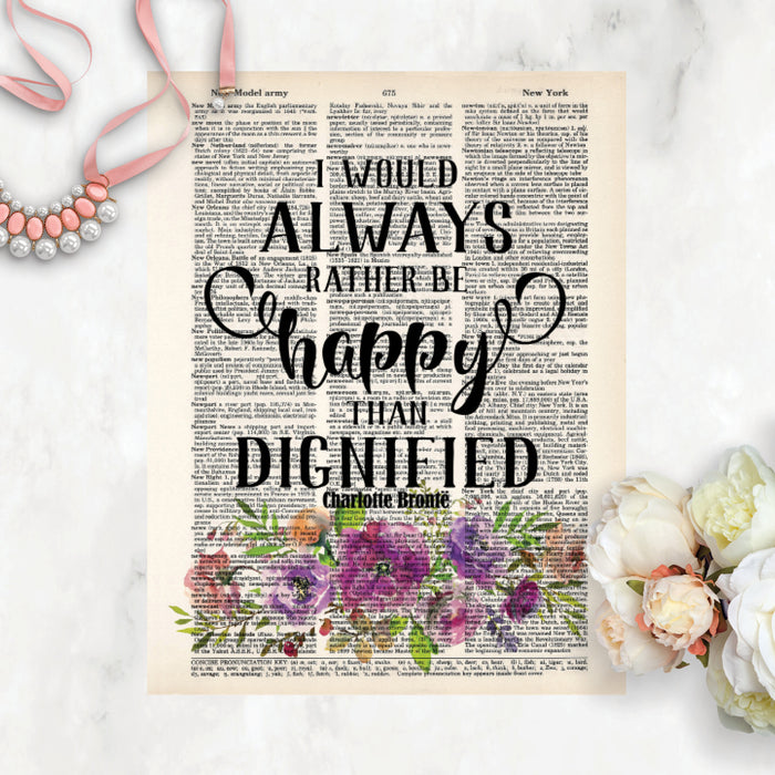 I would always rather be happy than dignified quote by Charlotte Bronte in black in above watercolor flowers in purple tones with greenery on salvaged dictionary page