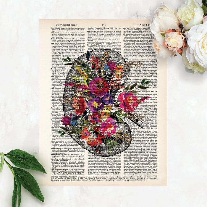 kidney etching topped with watercolor flowers in shades of pinks, purples, blues, and golden tones printed on a dictionary page