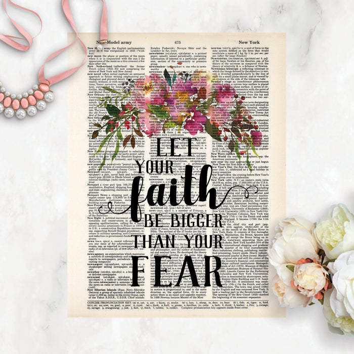 Let your faith be bigger than your fear with a spray of pink flowers with greenery at the top of the page printed on salvaged dictionary paper