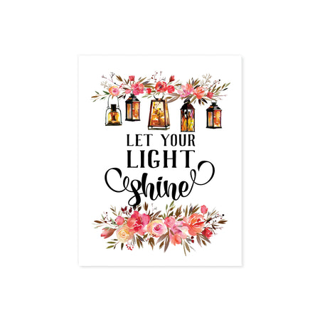 let your light shine is printed in black ink, at the top of the page there is a spray of pink and salmon colored flowers with five lanterns glowing amber with light, there are matching flowers and greenery at the bottom of the matte white paper