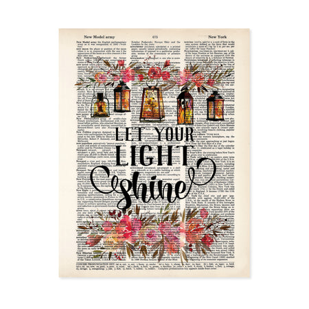 let your light shine is printed in black ink, at the top of the page there is a spray of pink and salmon colored flowers with five lanterns glowing amber with light, there are matching flowers and greenery at the bottom of the dictionary page
