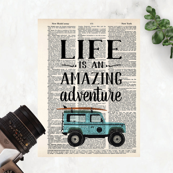 quote Life is an amazing adventure with a blue SUV with a surf board on the roof rack at the bottom printed on a salvaged dictionary page