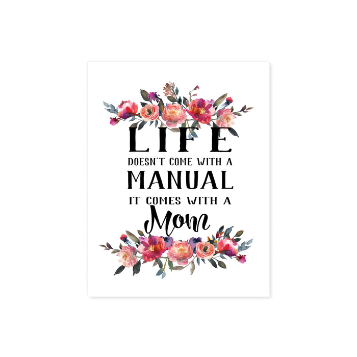 Watercolor flowers in pinks and peach tones top and bottom with the words Life doesn't come with a manual it comes with a mom in between printed on matte white paper