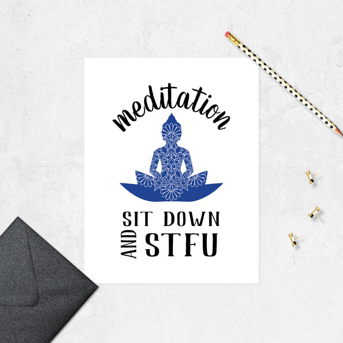 meditation text arced over a blue buddha figure with a mandala on it and the text sit down and STFU below printed on matte white paper