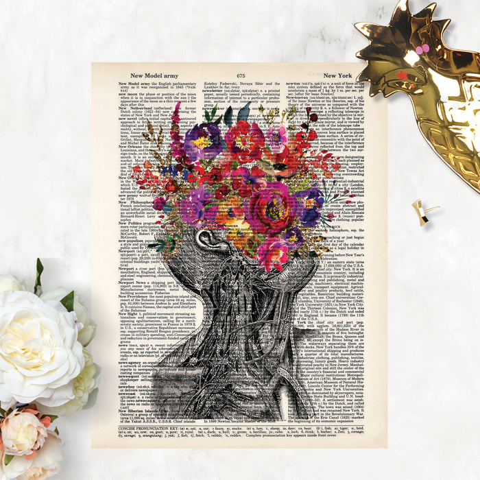 vintage neck with pink purple and yellow flowers replacing the face printed on a dictionary page