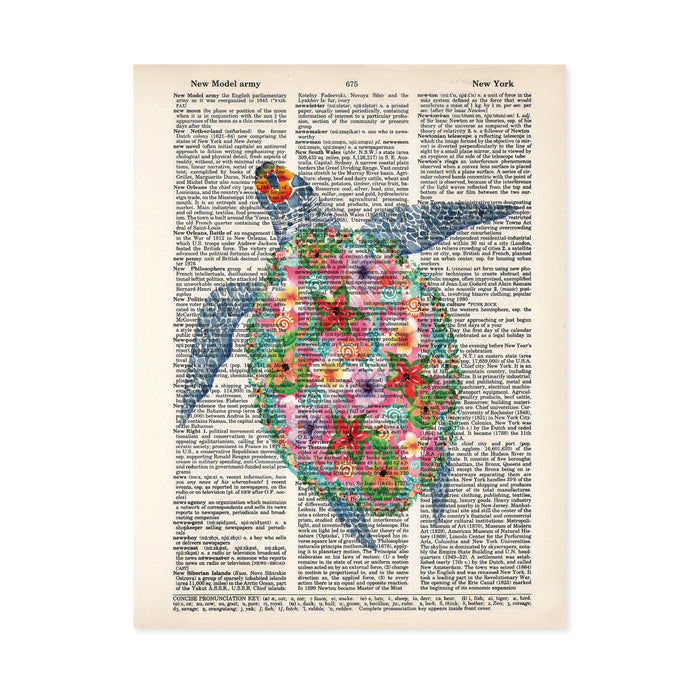 sea turtle in watercolors but with tropical flowers decorating the shell in shades of pink, purple, yellow printed on a dictionary page
