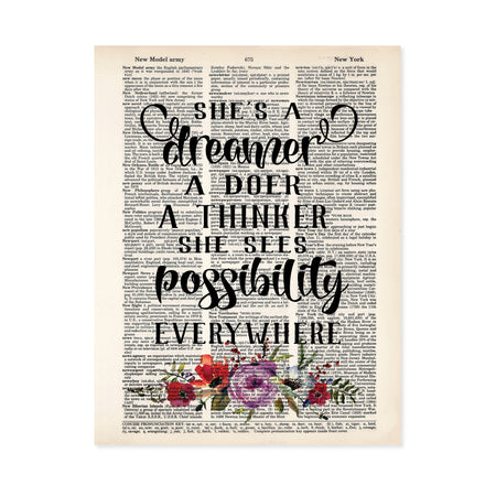 She's a dreamer a doer a thinker she sees possibility everywhere with lavender, pink, blue, and coral flowers and greenery in watercolor at the bottom printed on a dictionary page 