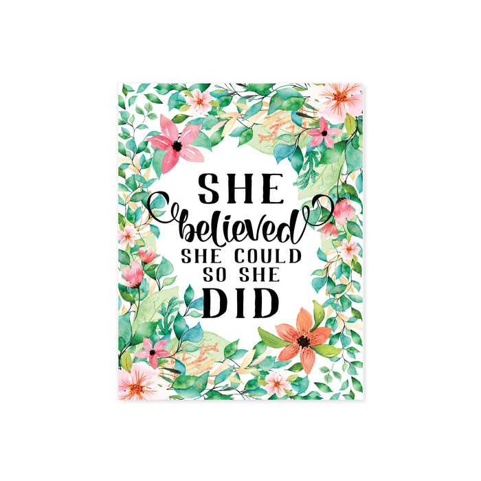 she believed she could so she did surrounded by watercolor tropical flowers in shades of pink and coral along with lush tropical greenery printed on matte white paper