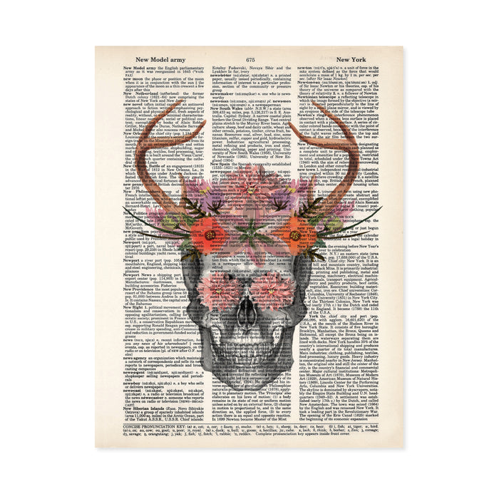 pencil sketch of a skull with watercolor antlers and flowers in pinks, purples, and salmon tones with flowers covering the eyes printed on a dictionary page