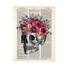 skull etching topped with pinke, yellow, purple, and blue watercolor flowers printed on a dictionary page
