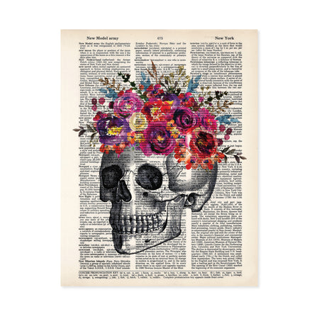 skull etching topped with pinke, yellow, purple, and blue watercolor flowers printed on a dictionary page