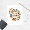 illustrated flowers in teal blue, peach, orange, and golden tones around a tear droped shape on angle with the words stay curious printed in black ink printed on matte white paper