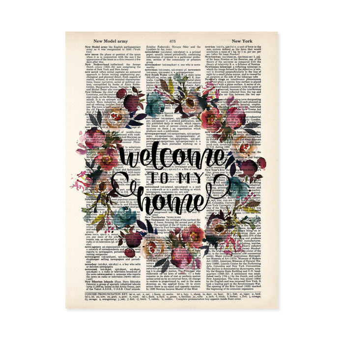 welcome to my home surrounded by a watercolor wreath in muted tones of pink, purple, blue and greenery printed on a dictionary page