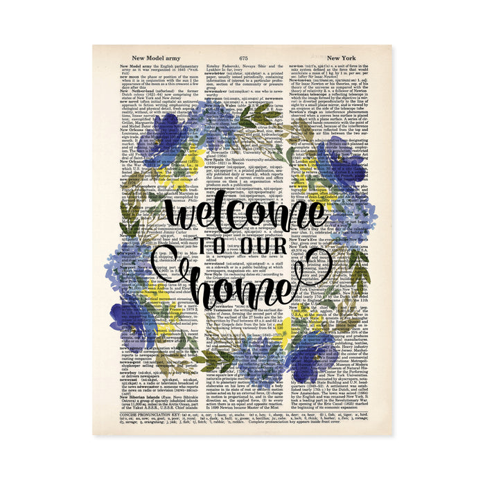 welcome to our home surrounded by a watercolor wreath in blue and yellow colors with greenery printed on a dictionary page