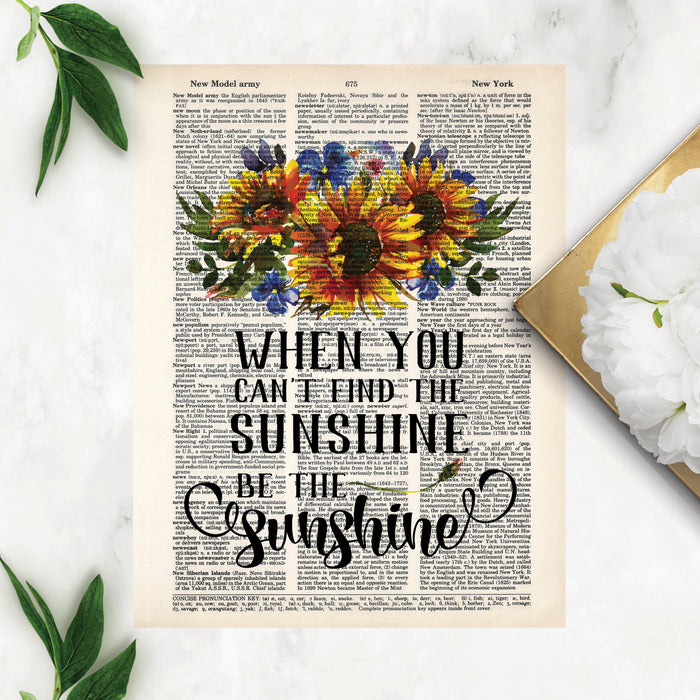 when you can't find the sunshine be the sunshine with watercolor sunflowers with blue and green accents printed on a dictionary page